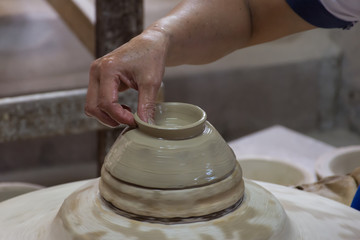 The technician form bottom bowl by wet clay