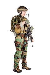 Portrait soldier or private military contractor holding sniper rifle.
