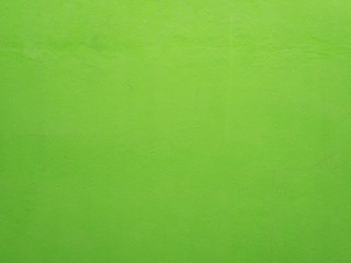 Green concrete wall with water drops for background.