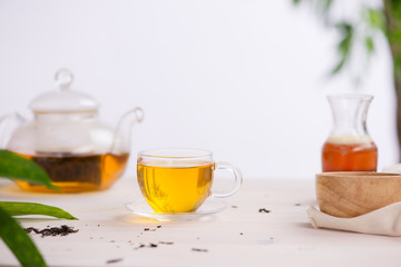 Cups of tea on wooden table background
