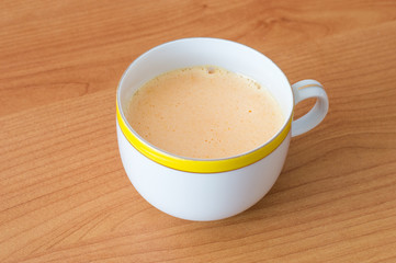 A dish of creamy homemade Kogel mogel. Kogel mogel is a dessert made from egg yolks and sugar.