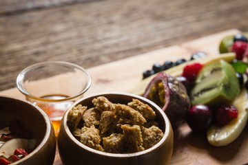 Breakfast and fruits on chopping board