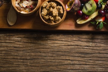 Breakfast and fruits on chopping board