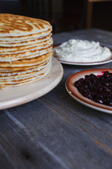 Pancakes with sour cream and jam