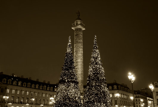 Christmas in Paris, France. Vendome square decorated for holidays. Sepia photo.