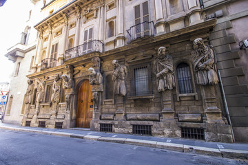 Fototapeta na wymiar Casa degli Omenoni, a historic palace of Milan was designed by sculptor Leone Leoni for himself. It owes its name to the eight atlantes decorating its facade, termed omenoni (big men in Milanese)
