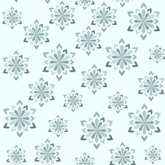 Abstract winter seamless pattern. Snowflakes of different sizes on a light blue background.