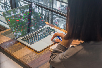 Freelancer investor watch the stock market on laptop