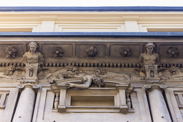 Casa degli Omenoni, a historic palace of Milan was designed by sculptor Leone Leoni for himself. It owes its name to the eight atlantes decorating its facade, termed omenoni (big men in Milanese)