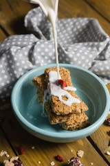 Milk being poured on granola bar