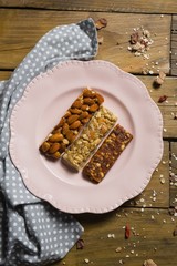 Three dry fruits bars arranged in plate