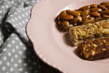 Three dry fruits bars arranged in plate