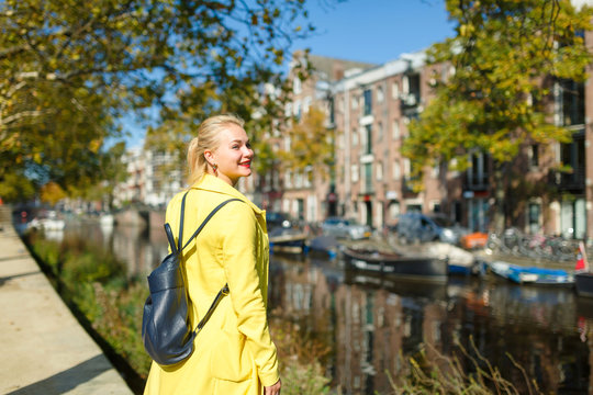 Cheerful young woman in Amsterdam