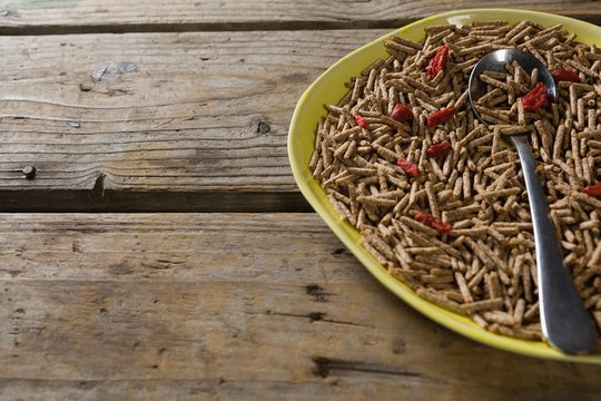 Cereal bran sticks with spoon in plate