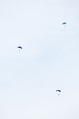 Three parachute jumping