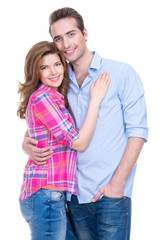 Smiling couple in casual standing in studio.