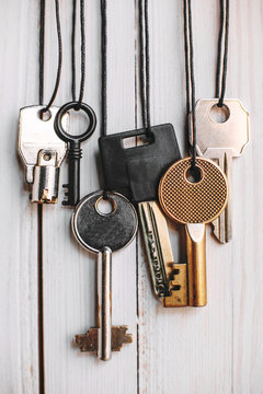 Some keys hanging on white.