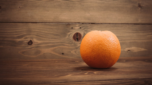 Fresh organic oranges fruits on wooden table
