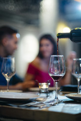 serving wine at the table with glass