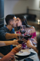 friends toasting with wine