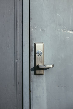 Grey door and lock on building exterior