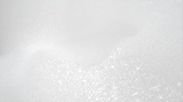 Abstract white foam bubbles structure pattern moving close-up