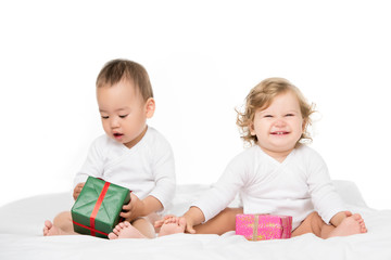 multiethnic toddlers with wrapped gifts