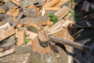 Close up of a pile of cracked wood in a rural yard. Shallow depth of field.