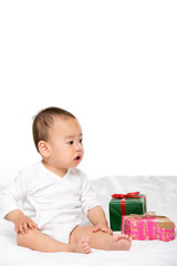 Fototapeta na wymiar asian toddler and wrapped presents