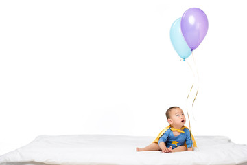 Fototapeta na wymiar asian toddler with balloons