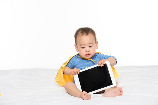 asian toddler boy with tablet