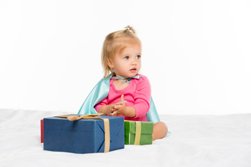 baby with wrapped gifts