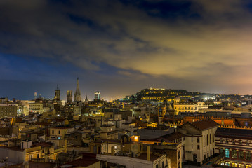 View of the roofs of Barcelona at night - 1