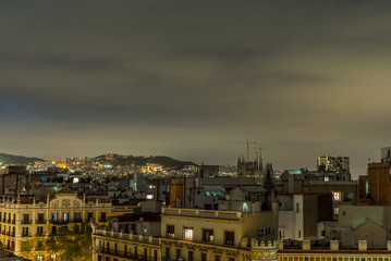 View of the roofs of Barcelona at night - 2