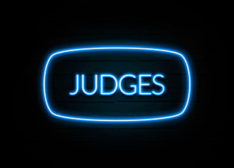 Judges  - colorful Neon Sign on brickwall