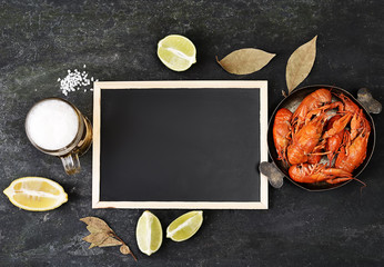 boiled crawfish in a plate on a black background