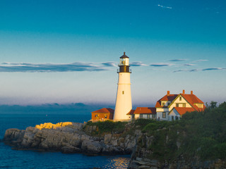 Fototapeta na wymiar Scenic Lighthouse Set Against Blue Sky