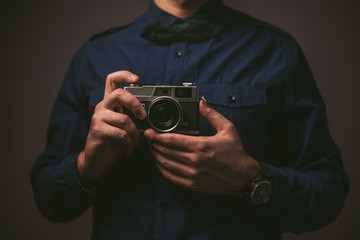 Man holding analog camera