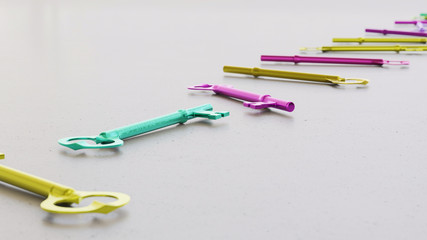 Long isolated line of brightly colored classic keys on a neutral surface