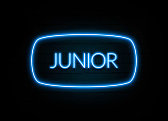Junior  - colorful Neon Sign on brickwall