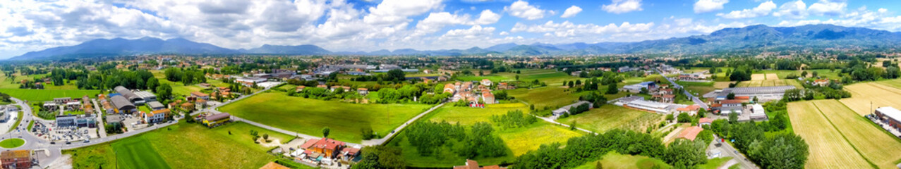 Aerial panoramic view of Lucca Countryside. City and mountains, Tuscany - Italy