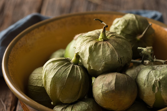 Green tomatillos in bowl