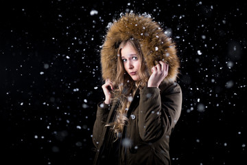 Beautiful girl in a snowfall