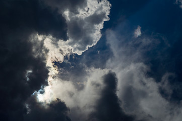 Naklejka na ściany i meble dark clouds in bad weather with sunshine