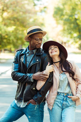 Girlfriend hugging her boyfriend on street