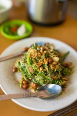 Traditional burmese tea leaf salad with fermented green tea leaves in Myanmar