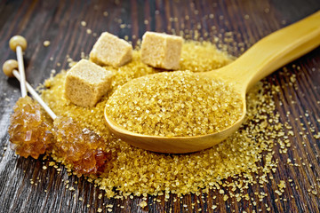 Sugar brown in spoon on board