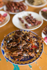 Deep fried chickens on sticks in Myanmar. Burmese traditional snacks