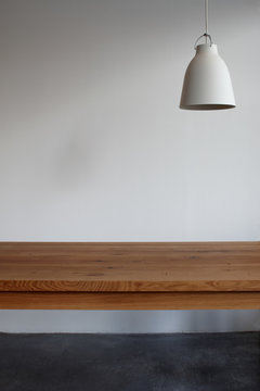 Interior design with wooden table and hanging lamp