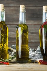 Olive oil bottles with herbal and spices